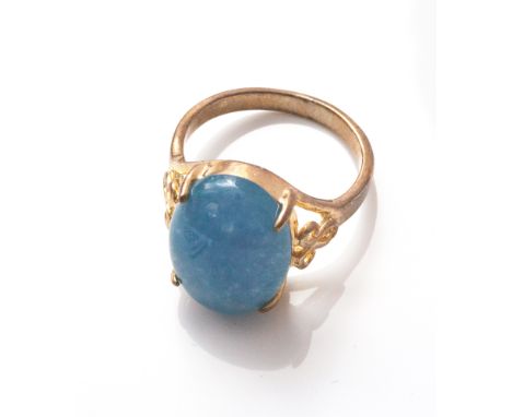 Oval dress ring set with blue hardstone, shank stamped 18ct - size R 