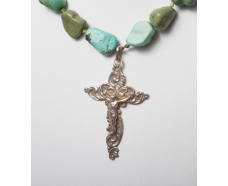 Turquoise bead necklace with cross pendant and a silver and marcasite cameo set ring. 