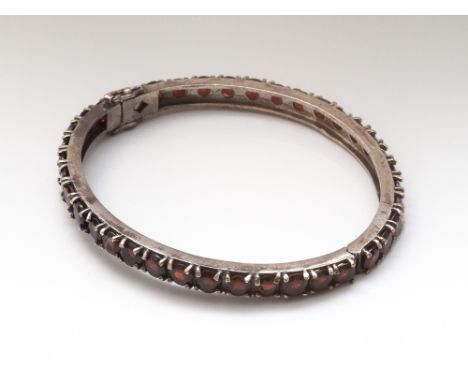 Silver and garnet ladies hinged bangle 