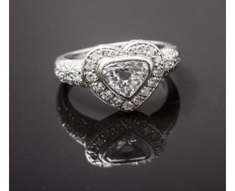 Large diamond heart shaped ring, set with a central heart shaped trilliant cut diamond of 1 carat, surrounded by brilliant cu