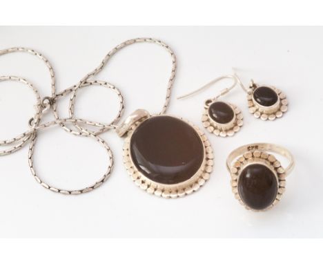 Silver and onyx suite of jewellery comprising dress ring, pierced drop earrings and pendant and chain 