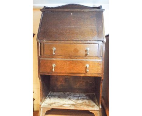 2' oak bureau with drawers and shelf under 