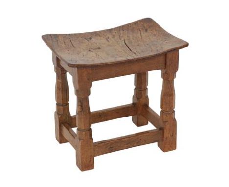 Robert Mouseman Thompson (1876-1955): An English Burr Oak Dish Top Stool, with nailed and adzed top on four octagonal legs jo