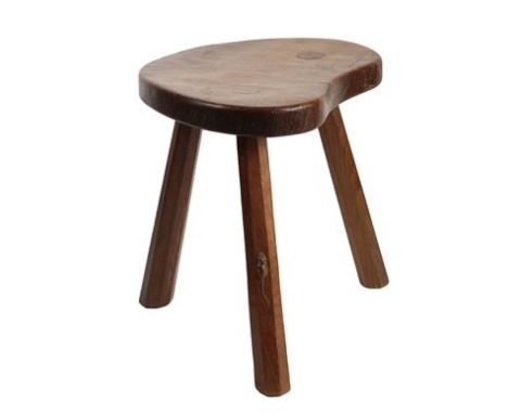 Robert Mouseman Thompson (1876-1955): An English Oak Calf Stool, the shaped 3cm thick top, on three octagonal legs, with tiny