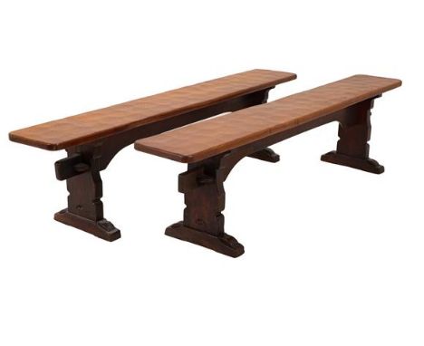 Robert Mouseman Thompson (1876-1955): A Pair of 6ft Oak Benches, on three shaped supports, joined by a top rail, both with re