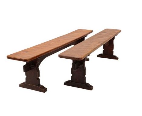 Robert Mouseman Thompson (1876-1955): A Pair of 6ft Oak Benches, on three shaped supports, joined by a rail (top) one with ca