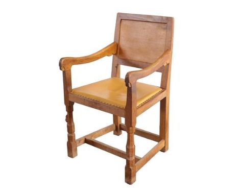 Workshop of Robert Mouseman Thompson (Kilburn): An English Oak Panel-Back Armchair, on octagonal front legs joined by a set-b