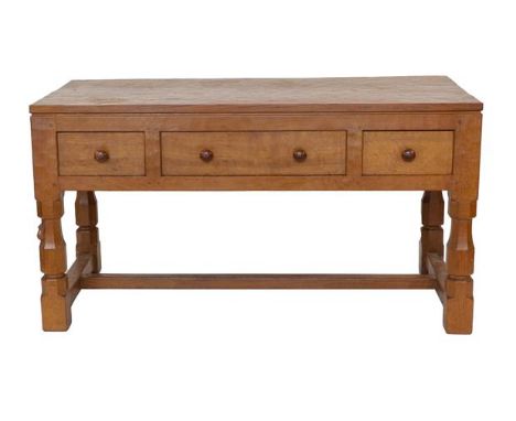 Robert Mouseman Thompson (1876-1955): An English Oak Table/Desk, 1940s, the three-plank rectangular top above one long and tw