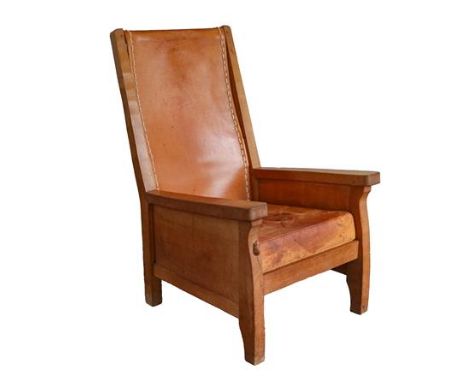 Workshop of Robert Mouseman Thompson (Kilburn): An English Oak Smoking Chair, slung leather back, straight arms, panelled sid