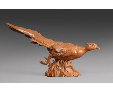 Workshop of Robert Mouseman Thompson (Kilburn): A Carved English Oak Pheasant, in a running pose, with carved mouse trademark