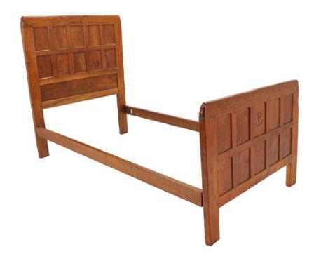 Robert Mouseman Thompson (1876-1955): An English Oak 3'2'' Single Panelled Bedstead, the headboard with carved monogram MFB a