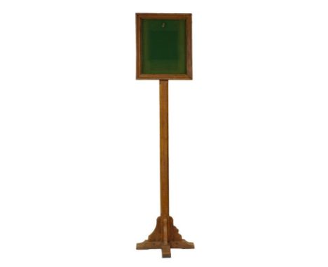 Workshop of Robert Mouseman Thompson (Kilburn): An English Oak Notice Stand, the rectangular frame inset with green baize, on