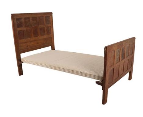 Robert Mouseman Thompson (1876-1955): A Burr Oak 3ft 6in Single Panelled Bedstead, circa 1930s, the headboard and footboard w