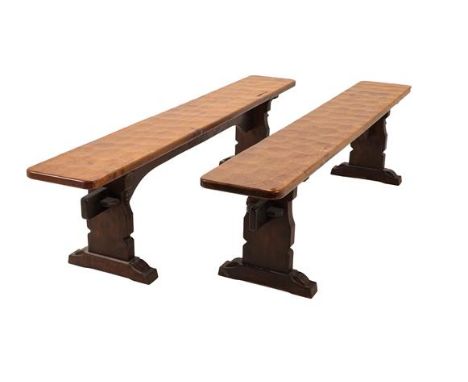 Robert Mouseman Thompson (1876-1955): A Pair of 6ft Oak Benches, on three shaped supports, joined by a rail (top) both with c