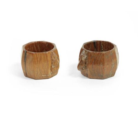 Workshop of Robert Mouseman Thompson (Kilburn): A Pair of English Oak Napkin Rings, of octagonal shape, each with carved mous
