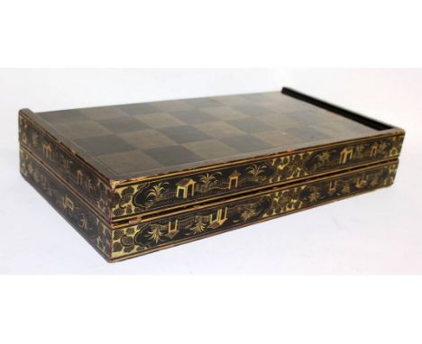 A CHINESE BLACK LACQUER BACKGAMMON BOARD with ivory pieces.