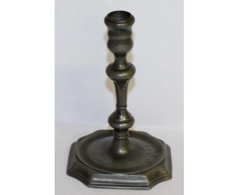 AN EARLY PEWTER CANDLESTICK with touch marks. 6ins high.