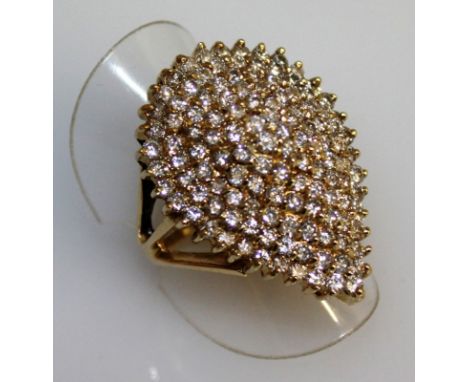 A SUPERB LARGE PEAR SHAPED DIAMOND CLUSTER RING of approx. 4cts, set in 14ct yellow gold.