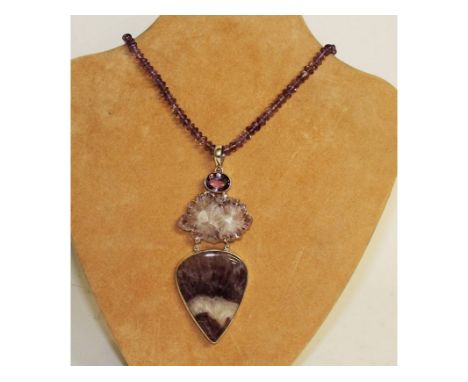 A SILVER AND NATURAL AMETHYST DESIGNER NECKLACE.