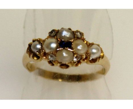 A 19TH CENTURY SEED PEARL AND SAPPHIRE RING in yellow gold.