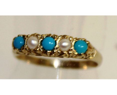 A 9CT GOLD TURQUOISE AND SEED PEARL RING.
