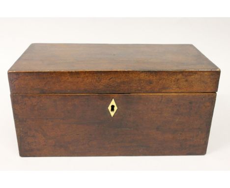 A 19TH CENTURY MAHOGANY PLAIN RECTANGULAR TEA CADDY with fitted interior. 12ins wide.
