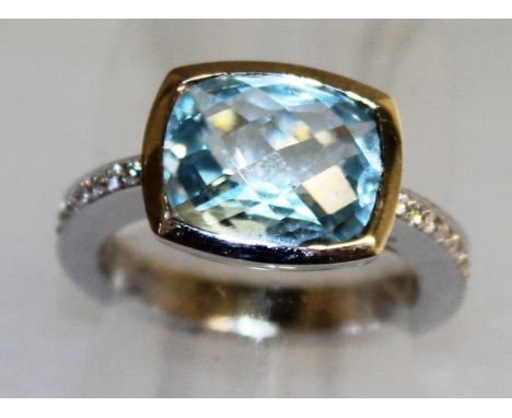 A BLUE TOPAZ AND DIAMOND RING, set in 18ct white gold.