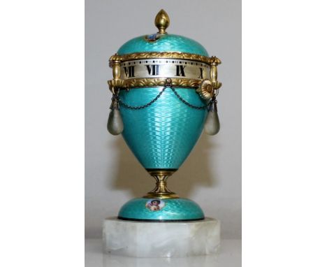 A SUPERB MINIATURE RUSSIAN BLUE ENAMEL "EGG" SHAPED CLOCK, dial on the side with silver gilt mount, the front with a portrait