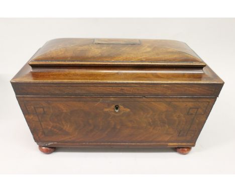 A LATE REGENCY MAHOGANY DOMED TOP TEA CADDY with fitted interior, brass ring handles to the sides, and supported on bun feet.