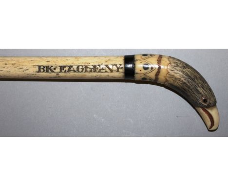 A RARE AMERICAN WHALEBONE STICK with carved eagle handle, 35ins long, engraved BK (Brooklyn) EAGLE N.Y., CAPTN W. WARD, CIRCA