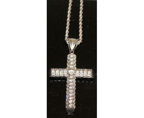 A STERLING SILVER AND CRYSTAL LARGE CROSS AND CHAIN.