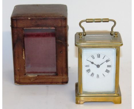 A 19TH CENTURY FRENCH TIMEPIECE CARRIAGE CLOCK, 4.5ins, in a leather carrying case.