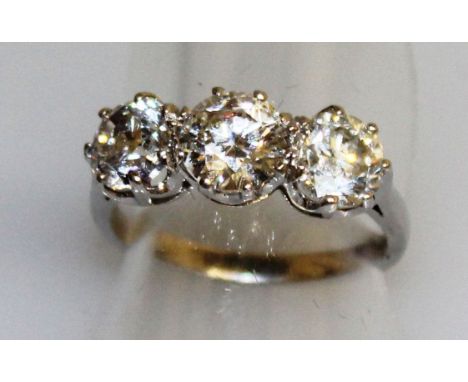 A SUPERB THREE STONE DIAMOND RING of 3.15cts, set in 18ct white gold.