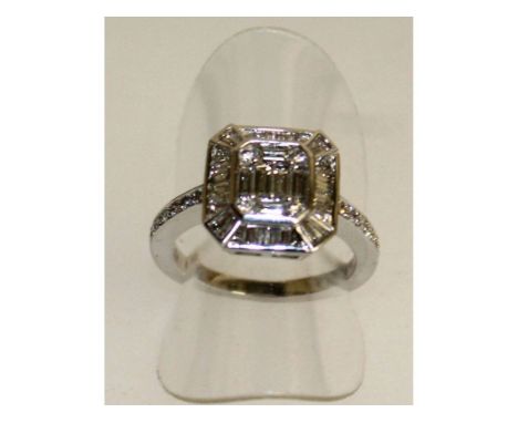 A GOOD 18CT WHITE GOLD DIAMOND BAGUETTE OCTAGONAL RING.