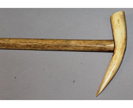 A RARE WHALEBONE STICK with plain attached handle. 36ins long.