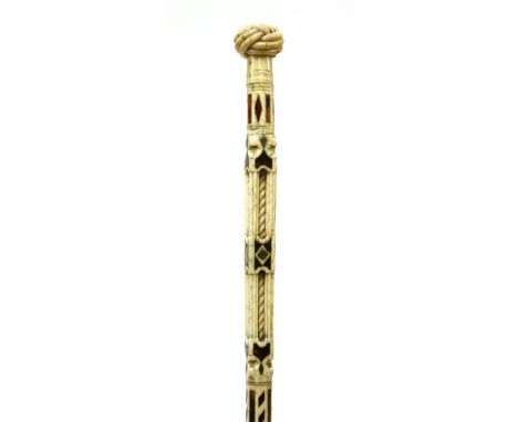 A fine and rare marine ivory and whalebone walking stick,with a Turk's knot over octagonal and square sections, the latter wi