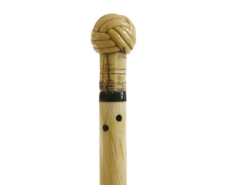 A marine ivory, whalebone and narwhal walking stick,with an undercut Turk's head knot handle, over an octagonal collar and ba