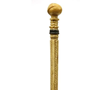 A marine ivory and whalebone walking stick,with a bird claw gripping a ball, over two baleen discs, above three sections, one