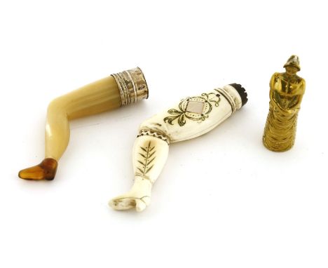 An unusual brass cigar cutter,c.1850, in the form of a lady, her bustle concealing a catch for the cutter,5cm high,a carved m