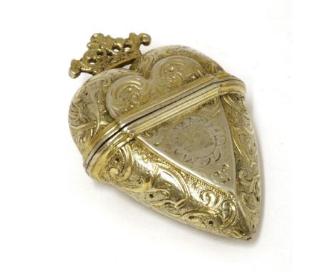A silver gilt hovedvandsæg,B... M..., probably Danish, 18th century,heart-shaped with engraved decoration,6cm highProvenance: