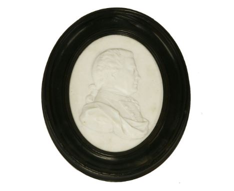 A Tassie white paste portrait medallion,of a gentleman, facing dexter, wearing a fichu and hair en queue,15.5cm overall