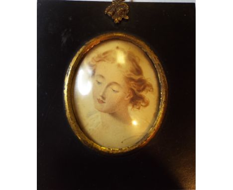 An oval bust portrait miniature, of a lady, watercolour, 8.5 x 7 cm