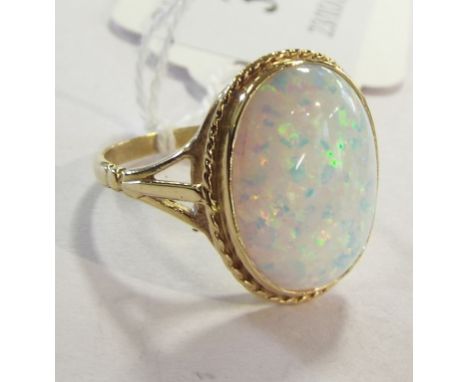 A 9ct gold and Gilson created opal ring