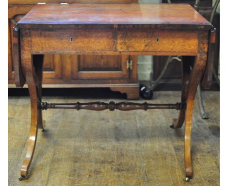 A Regency style sofa table, veneered in amboyna, on sabre end supports, 129 cm wide Condition report Report by GH

The table 