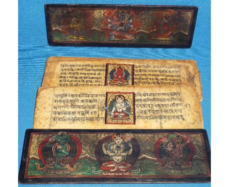 A Nepalese palm leaf manuscript, painted deities, with two wooden covers