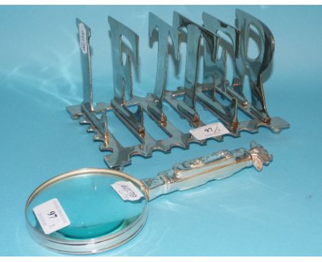 A novelty letter rack, the dividers spelling LETTER, 20 cm wide, and a magnifying glass, in the form of a golf caddy, 24 cm l