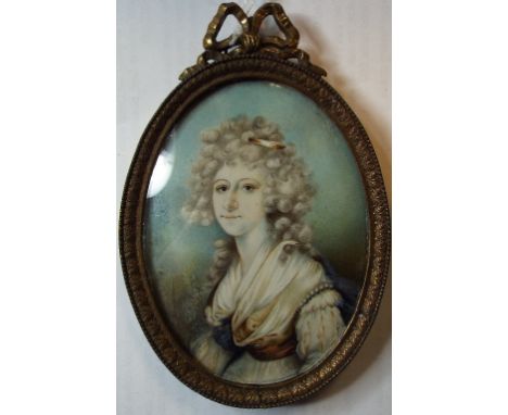 An oval bust portrait miniature, of a lady with a feather in her hair, watercolour on ivory, 8.5 x 6 cm