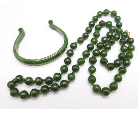 A nephrite jade necklace and a bangle 