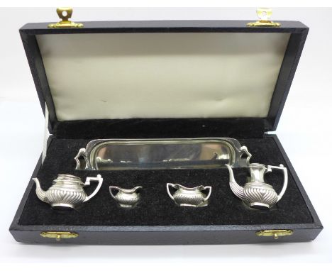 A hallmarked silver miniature tea service and tray, Birmingham 1972, tray 147mm 