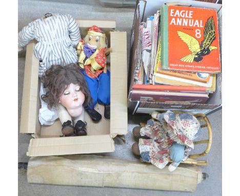 An Armand Marseille 390 doll, a/f, children's annuals, a puppet and a box of History of WWII magazines and anatomical chart 